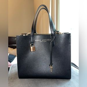 Black Marc Jacobs bag with gold hardware and crossbody strap